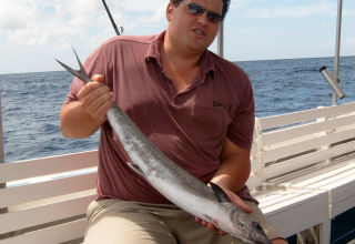 The author catching a king mackerel in the waters around Saint Lucia.